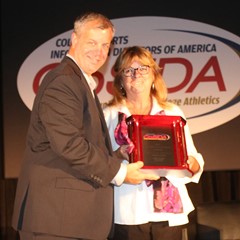 Carole Grills (Smith) accepted her CoSIDA Hall of Fame Award.